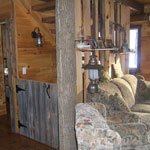 The Family Area of our cabin rental includes a fireplace, queen size sofa bed, easy chair & full entertainment center.